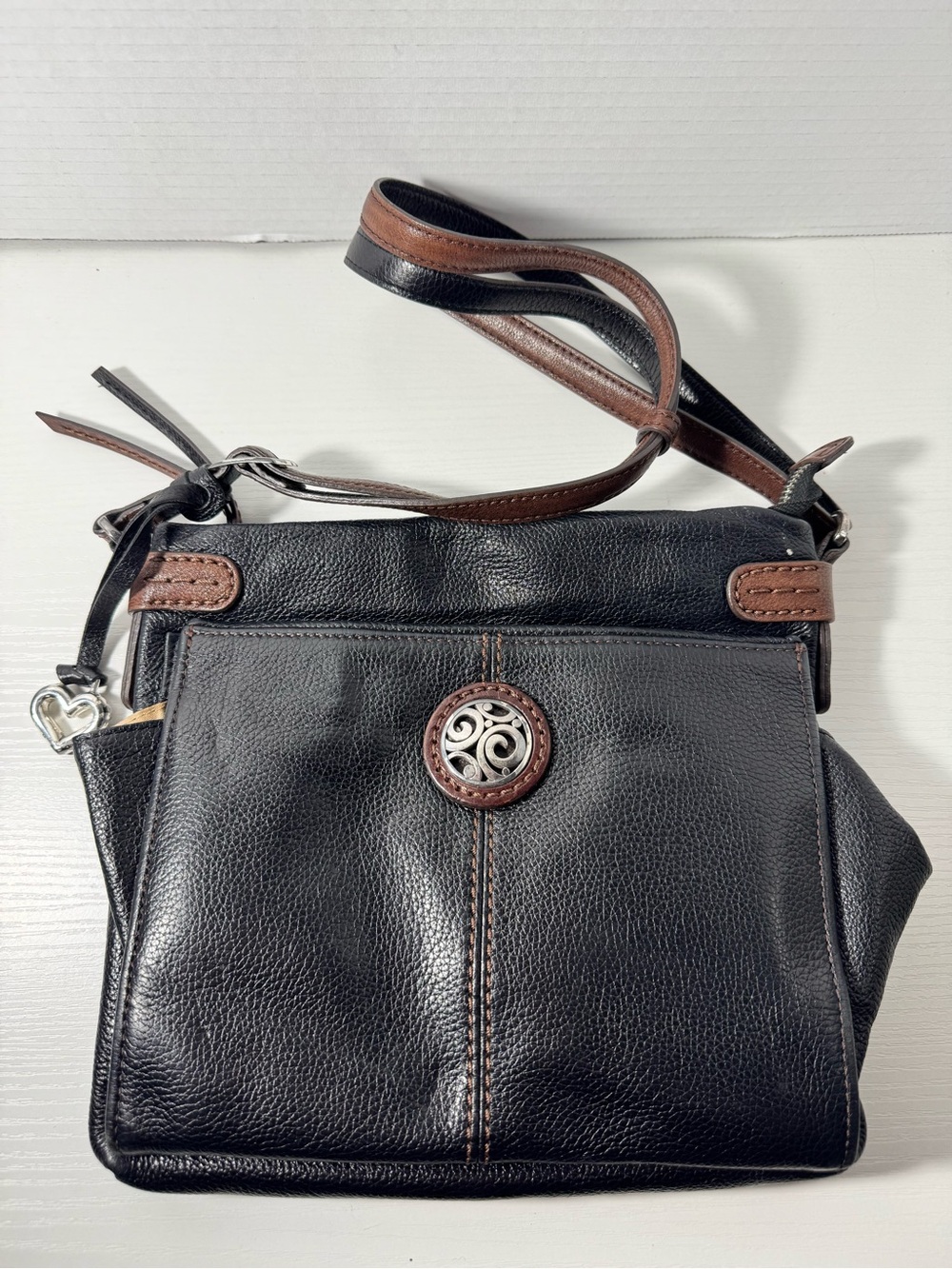 Brighton Black Leather Crossbody Organizer with Brown Trim and Silver Medallion